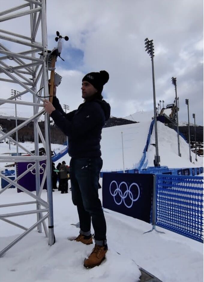HKBU Olympian installing an environmental monitoring station